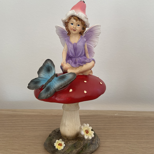 Fairy Figurine Sitting on Mushroom with Butterfly