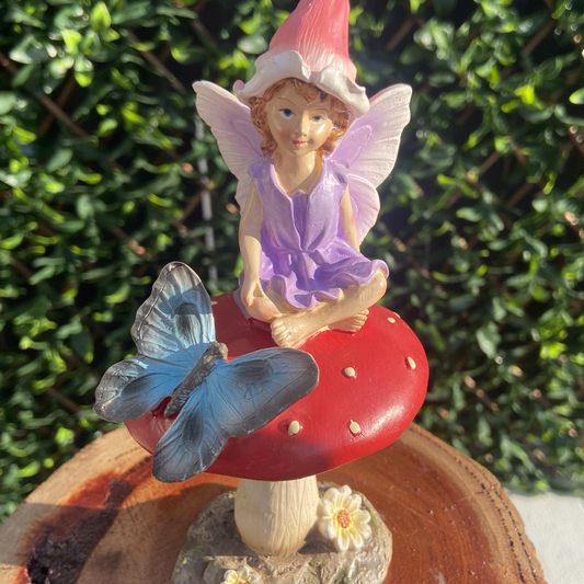 Fairy Figurine Sitting on Mushroom with Butterfly