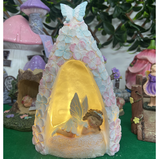 Fairy in a Light Up Pink and Blue Floral Cave