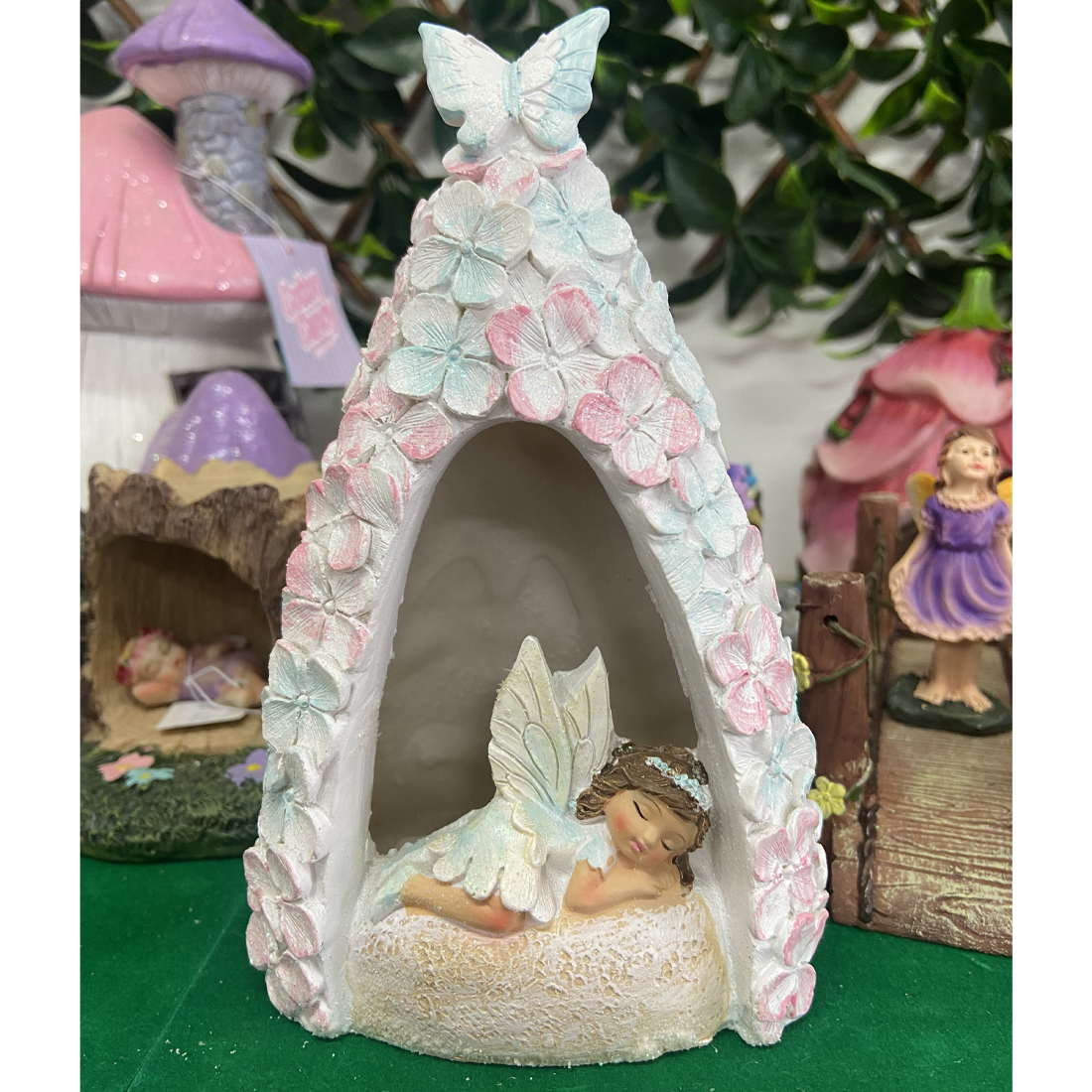 Fairy in a Light Up Pink and Blue Floral Cave