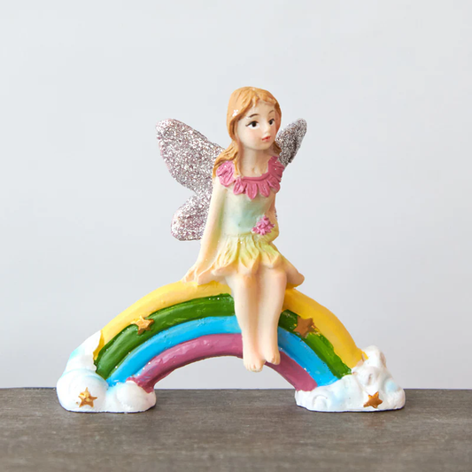 Fairy Sitting on Rainbow