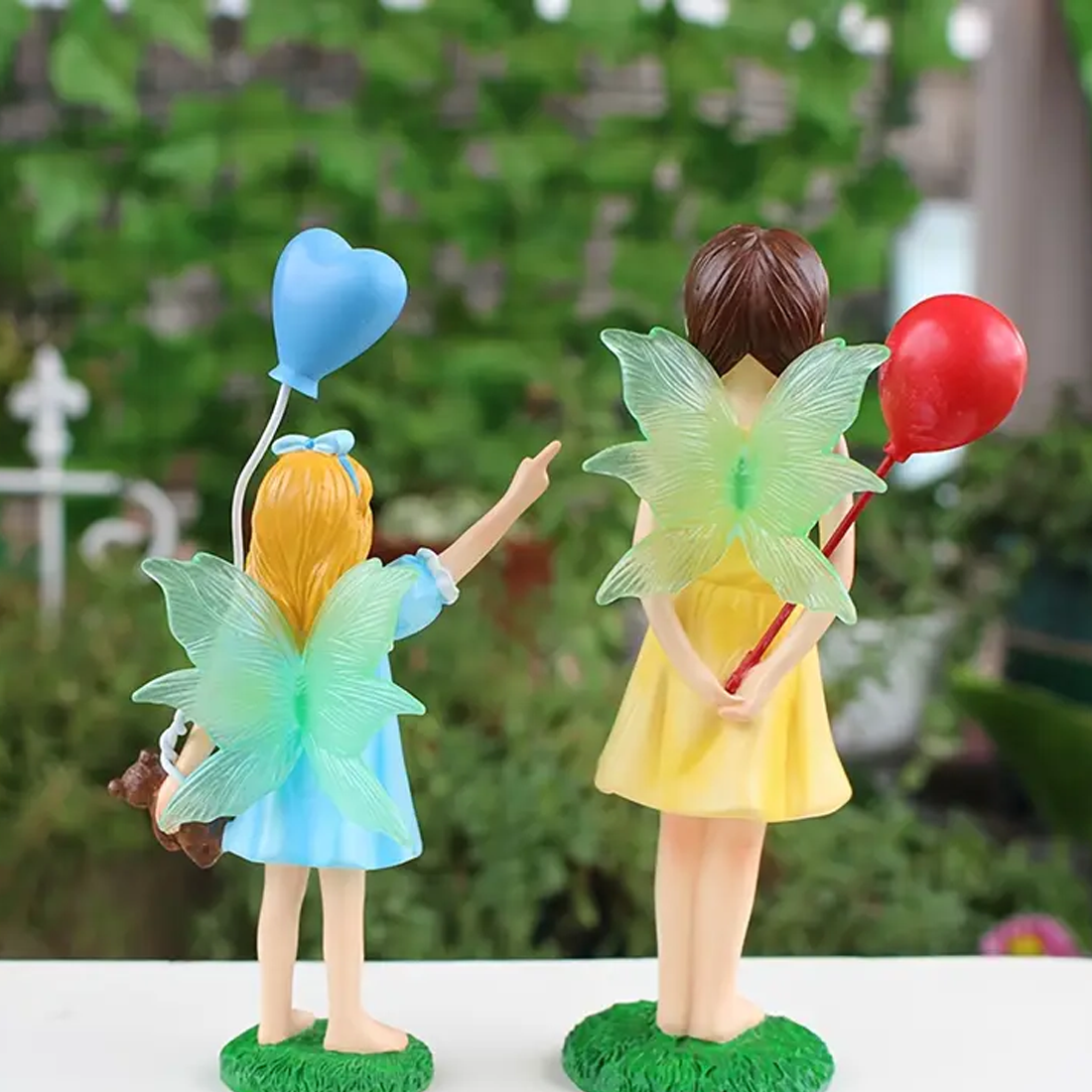 Two Fairy Sister Figurines With Balloons